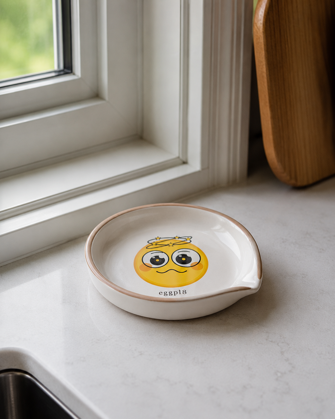 eggpl8 ceramic on a marble kitchen counter by a window